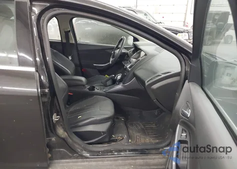 2014 Ford Focus Titanium z USA, uszkodzony, nr VIN 1FADP3J29EL315924